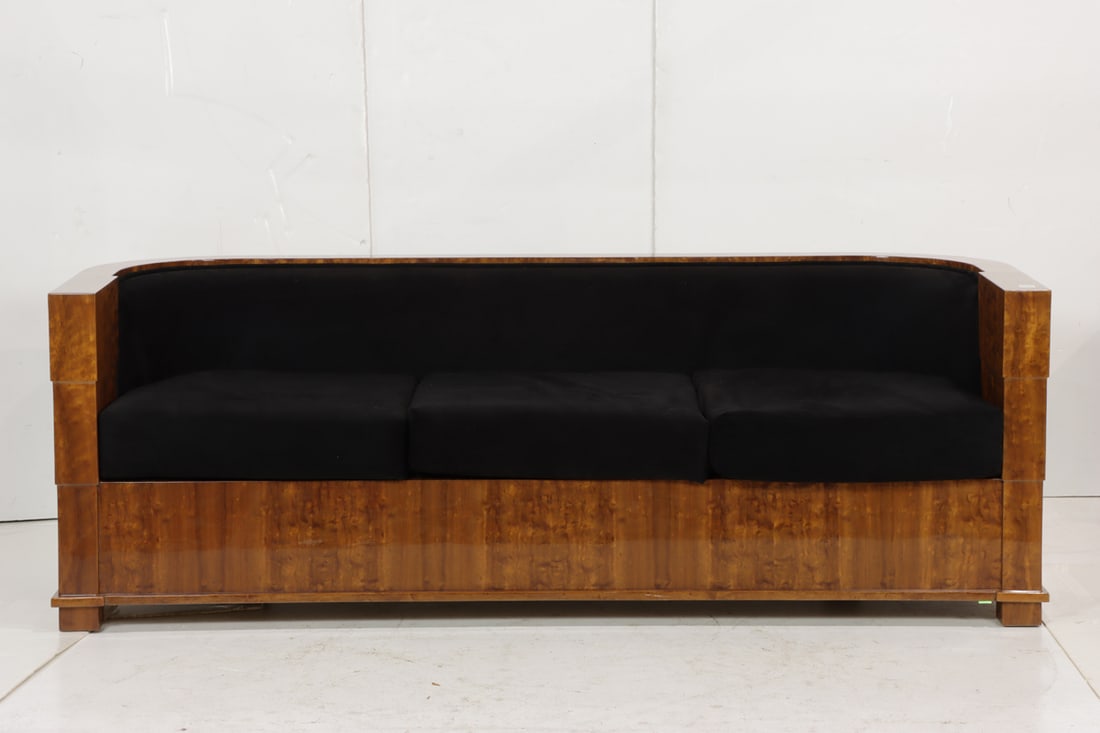 A Pace highly figured contoured sofa