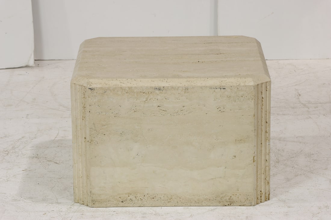 A travertine pedestal table: A travertine pedestal table, of square outline with fluted corners, 16.25"h x 24.25"w