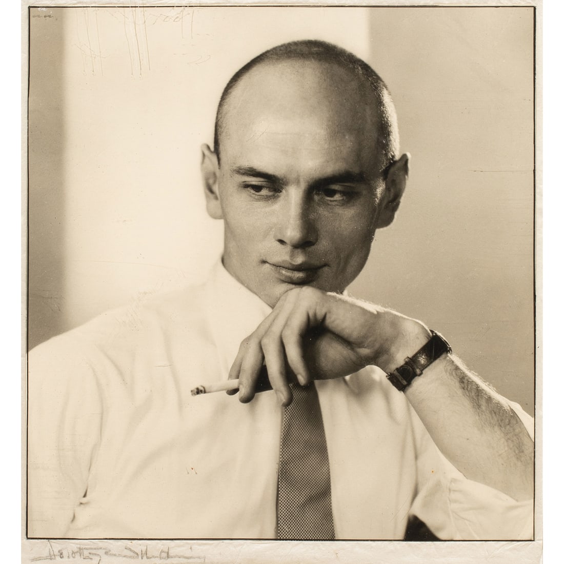 Photograph, Dorothy Wilding: Dorothy Wilding (British, 1893-1976), Yul Brynner, gelatin silver print, pencil signed lower left to backing, image: 10"h x 9"w, overall (with frame): 18"h x 15"w