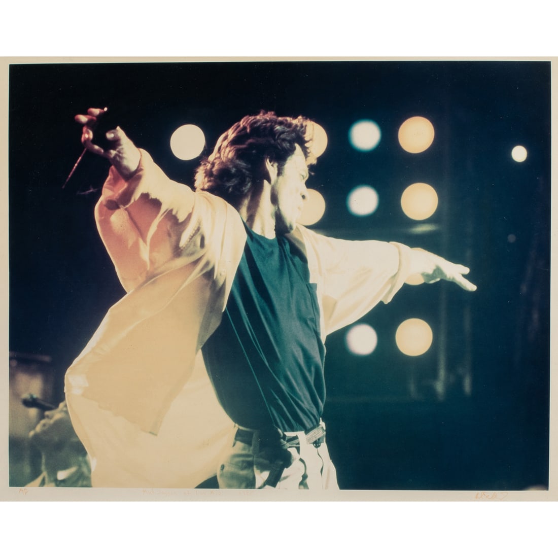 Photograph, John Bellissimo: John Bellissimo (American, 1951-1999), "Mick Jagger at Live Aid, 1985," c-print, ink signed lower right, titled lower center, AP, image: 16.5"h x 20.75"w, overall (with frame): 28.75"h x 33.75"w