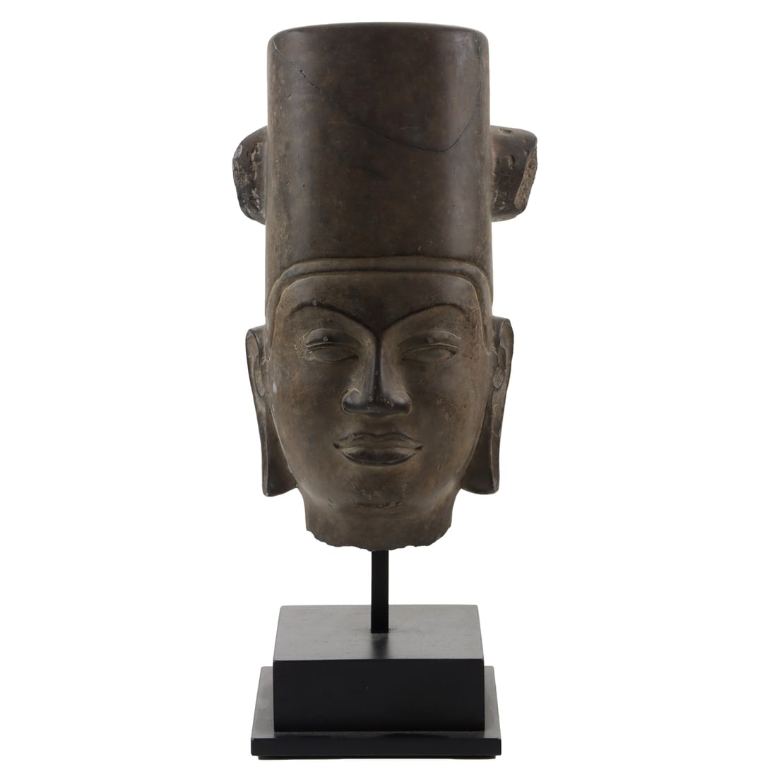 A sandstone head of Vishnu: A sandstone head of Vishnu. Phnom Da style, possibly Pre-Angkor period, 10.75" high excluding stand.