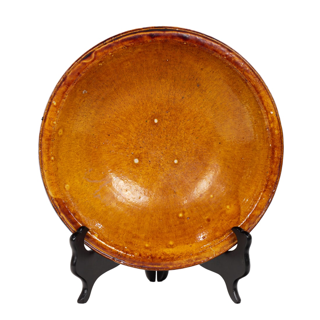 A Chinese amber glazed shallow bowl: A Chinese amber glazed shallow bowl. Ming dynasty, 11.5" across.