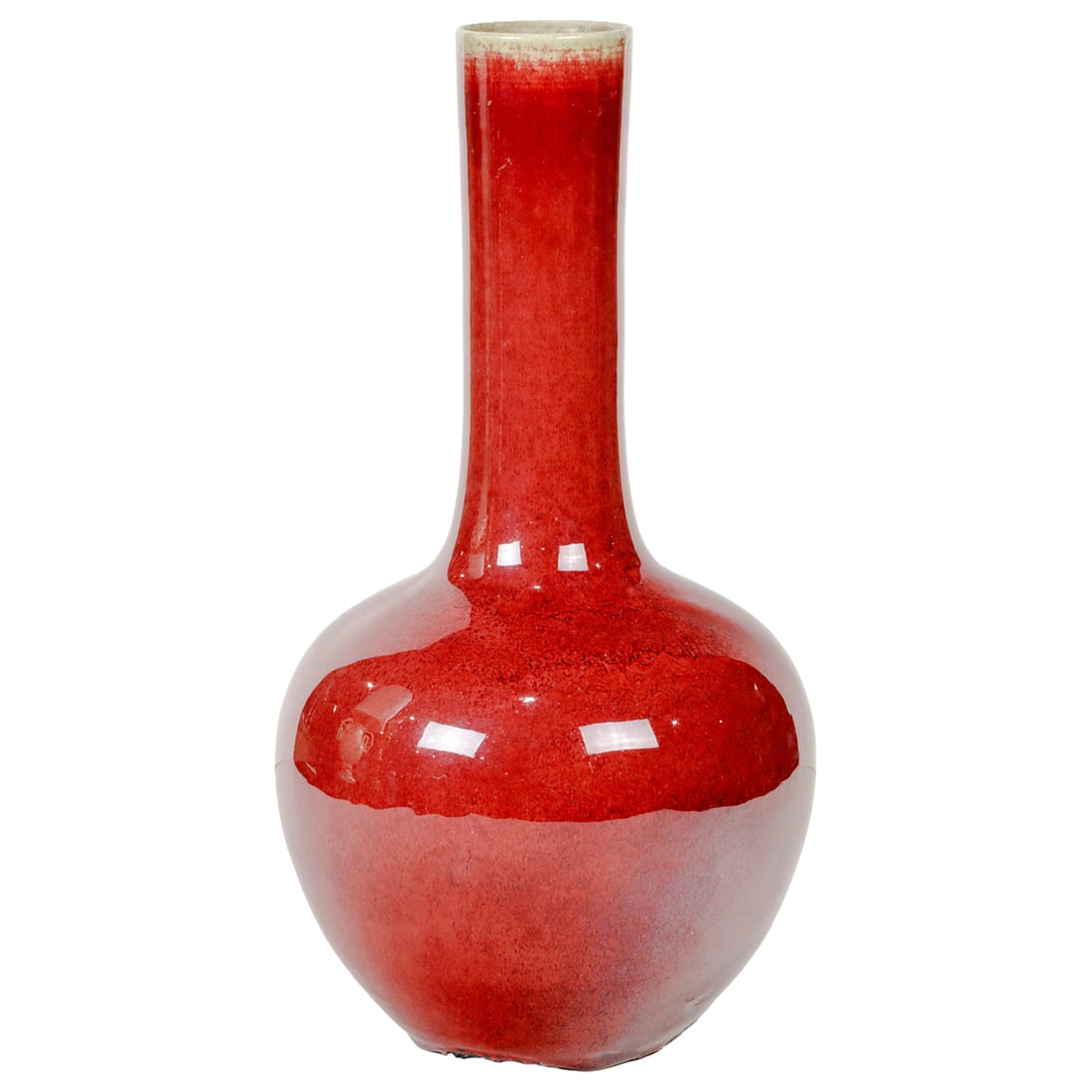 A Chinese ox-blood glazed bottle vase: A Chinese ox-blood glazed bottle vase. 19th century, 16.5" high.