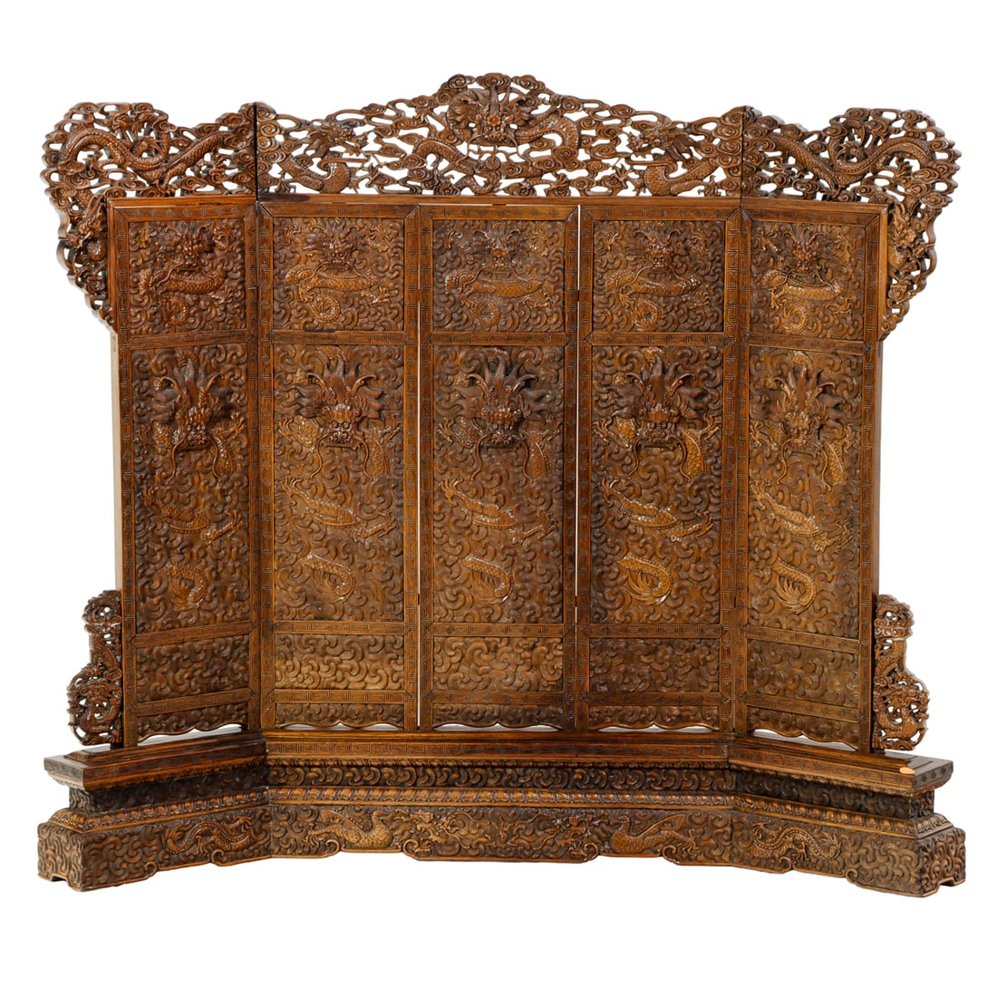 A Chinese huali rosewood 'dragon' floor screen: A Chinese huali rosewood 'dragon' floor screen. Carved in high relief with five-claw dragon amidst dense scrolling clouds, 19th century, 40.25"h x 44.25"w.
