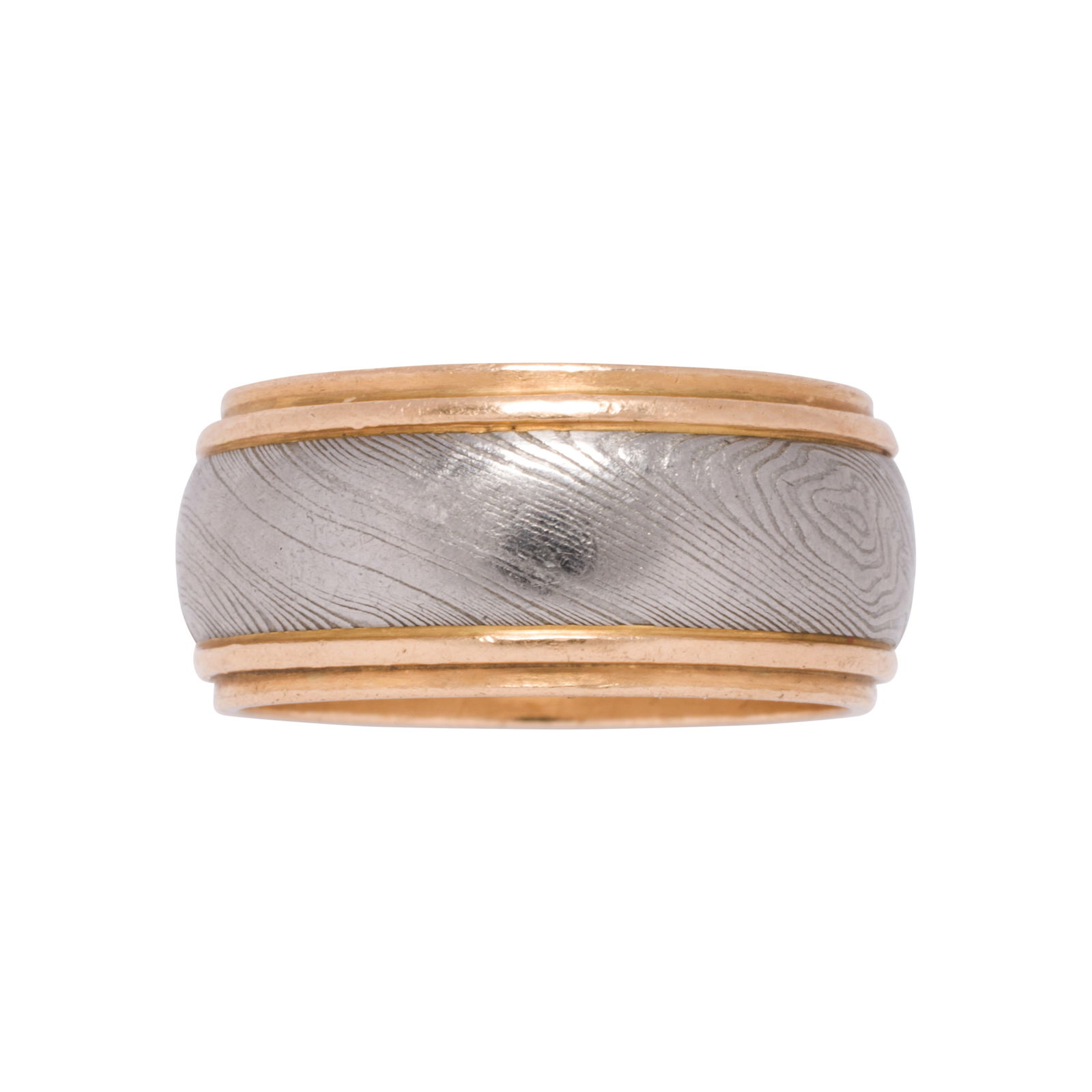 A platinum and 14k gold band: A platinum and 14k gold bandDesigned as a 14k gold band, accented by a channel of platinum inscribed with a wood grain pattern; size 9 1/2; 11.45 grams