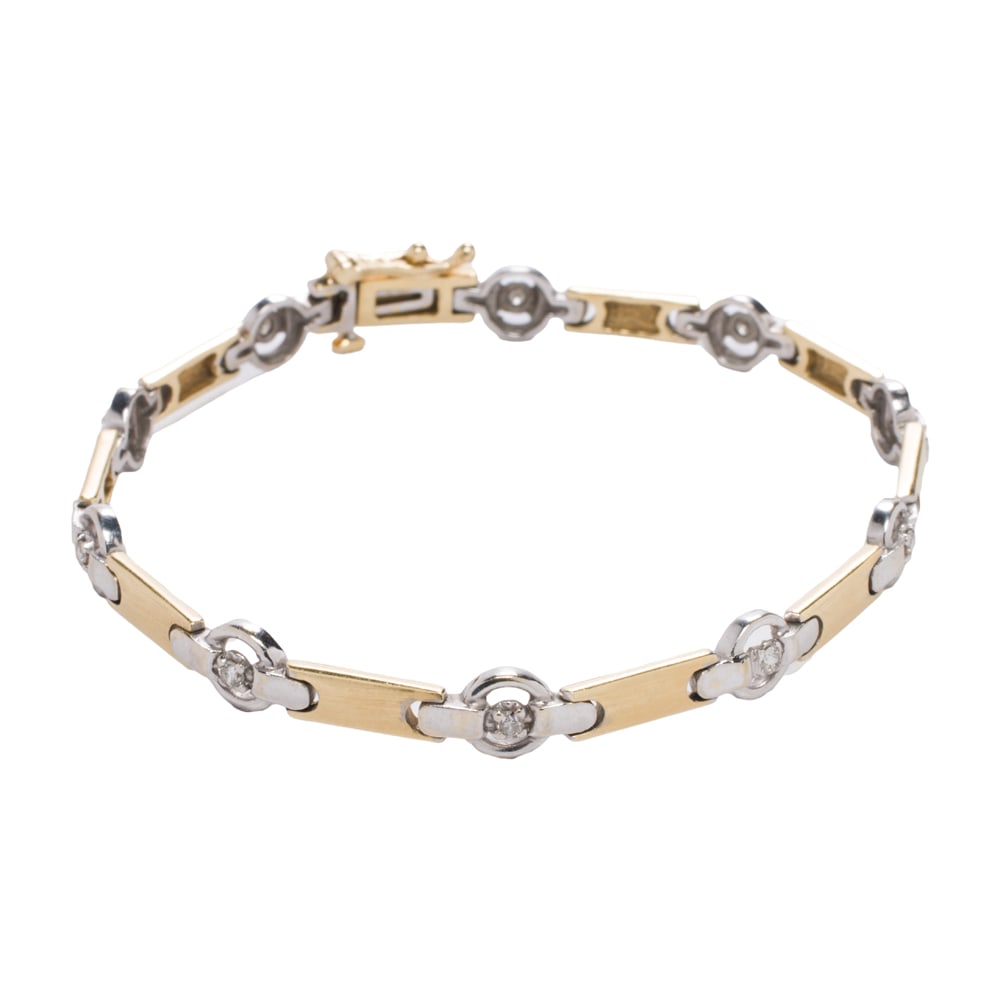 A diamond and 14k bi-color gold link bracelet: A diamond and 14k bi-color gold link braceletof fancy-link design featuring white gold spacers each centering a single-cut diamond; length: 7 in; 11.00 grams