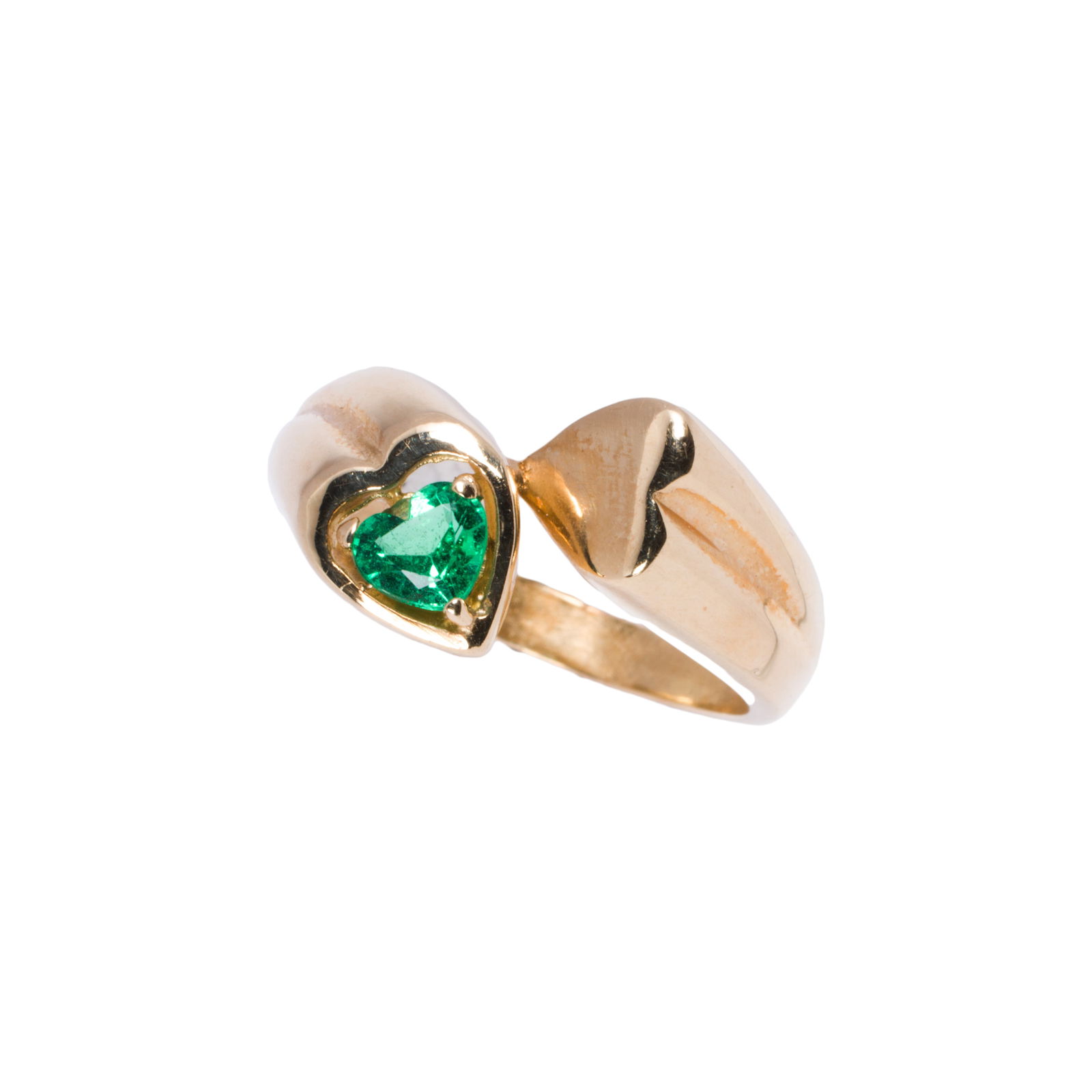 An emerald and 14k gold ring: An emerald and 14k gold ringof bypass design, featuring a heart-cut emerald measuring approximately 4.10 x 3.90 x 2.40 mm; size: 5; 3.5 grams