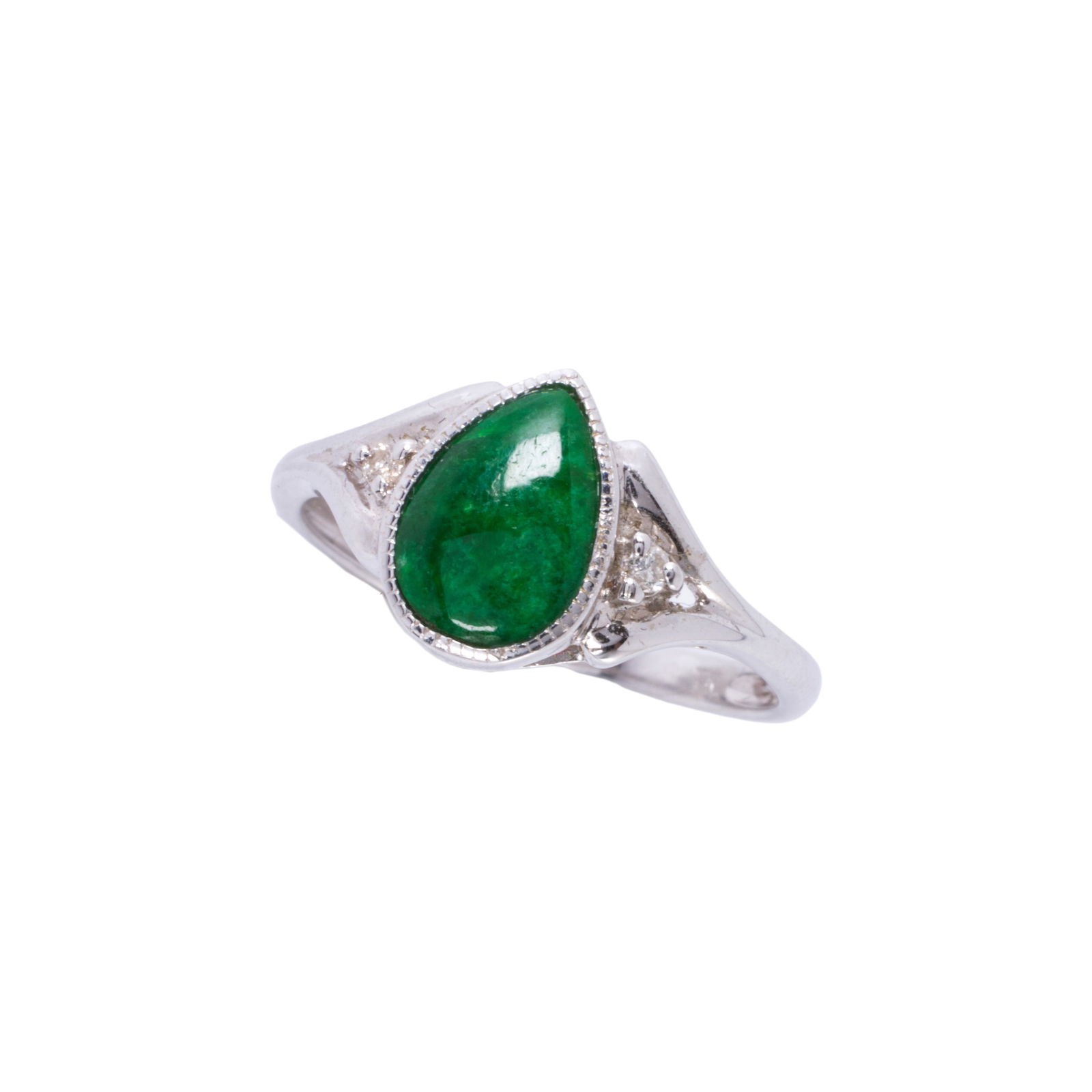 A jade, diamond and 14k white gold ring: A jade, diamond and 14k white gold ringcentering a pear-shaped jade cabochon measuring approximately 8.88 x 6.10, flanked by single-cut diamonds, in closed back mounting; ring size: 6 1/2 in; 2.80