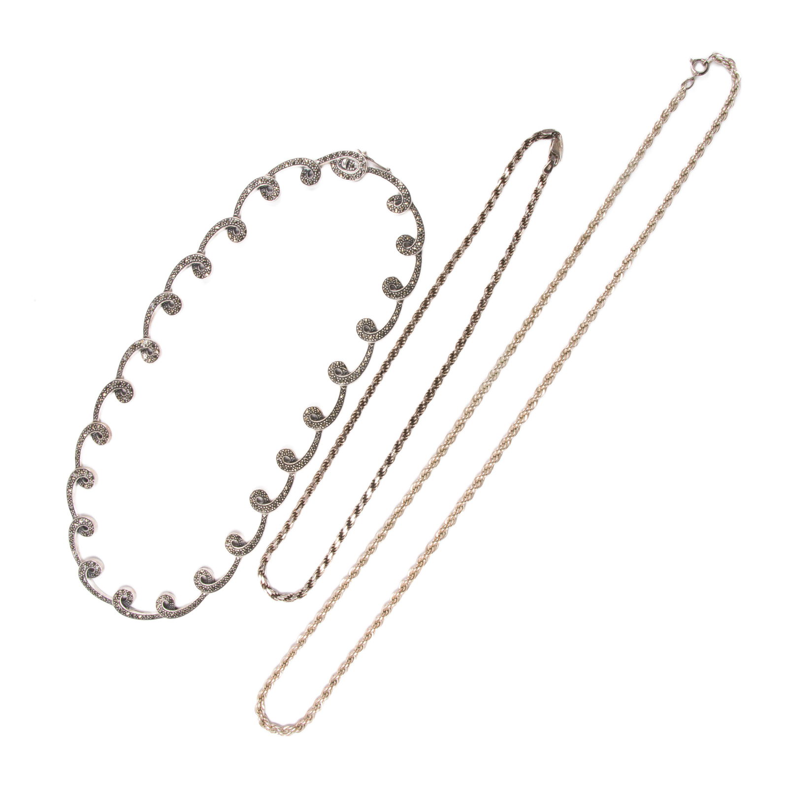 Three sterling silver chains: Three sterling silver chainsComprising three silver chains of varying styles; gross weight: 82.30 grams