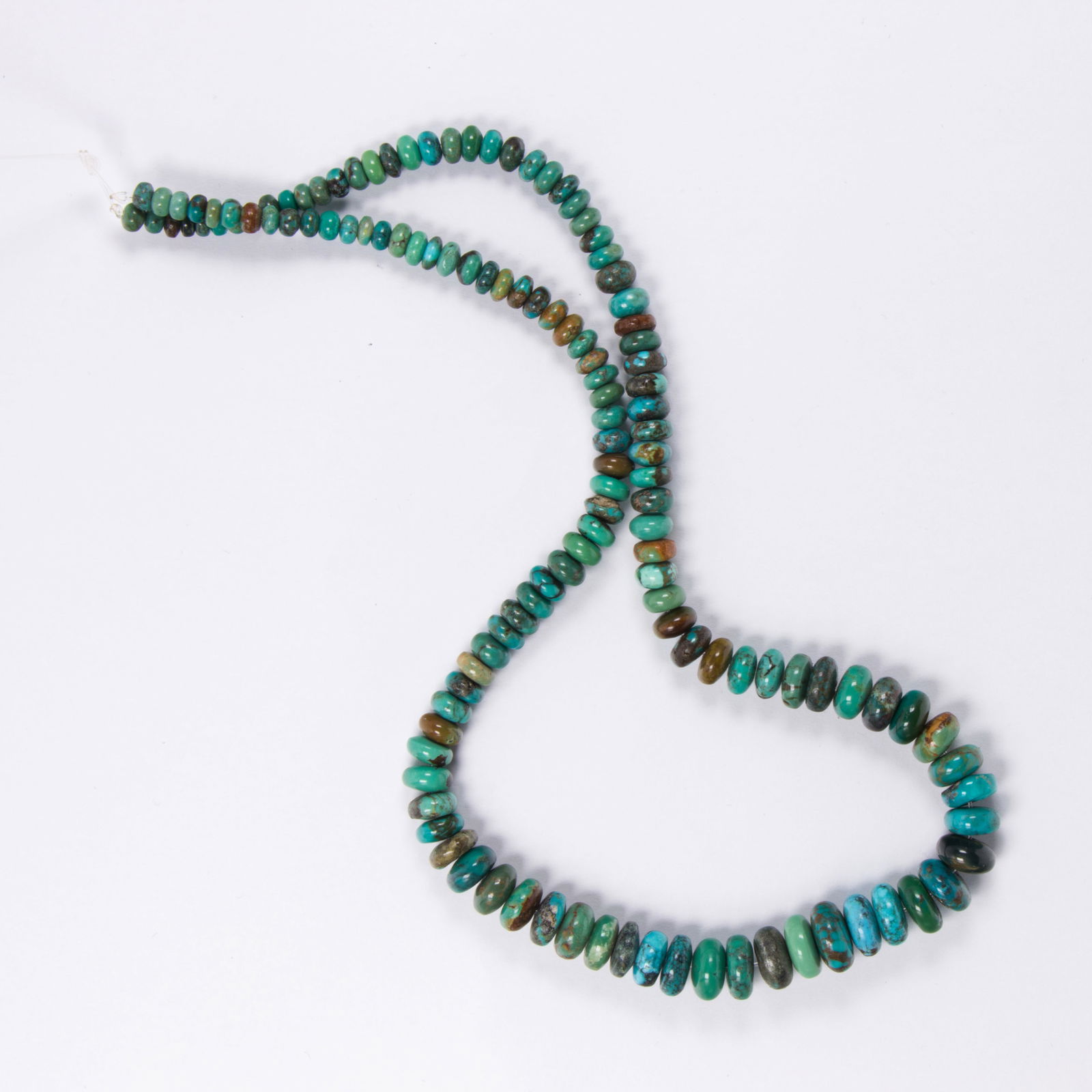 A turquoise bead necklace: A turquoise bead necklacedesigned as a single strand of multi-hue graduated turquoise beads; length: 16 in; 24.60 grams