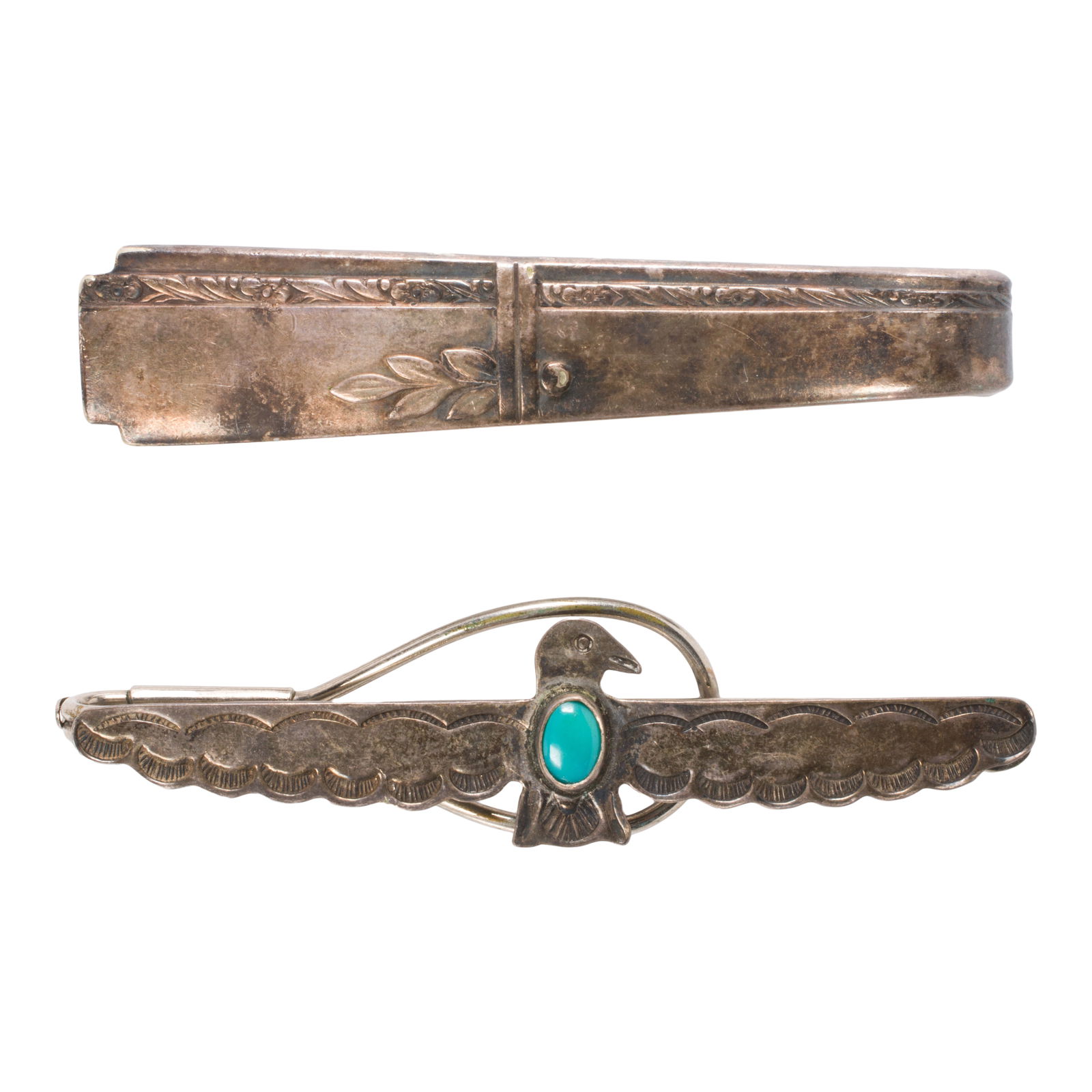 Two silver clips: Two silver clipsComprising two silver clips of varying styles; gross weight: 43.15 grams