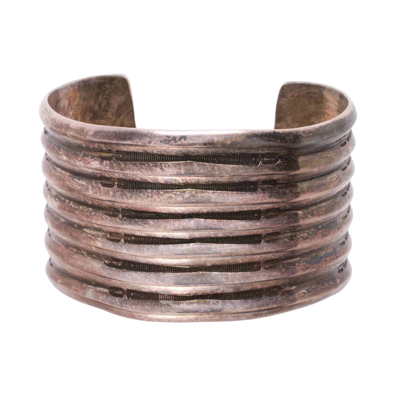 A silver cuff: A silver cuffDesigned with etched channels; length: 5 1/2 in; 87.85 grams