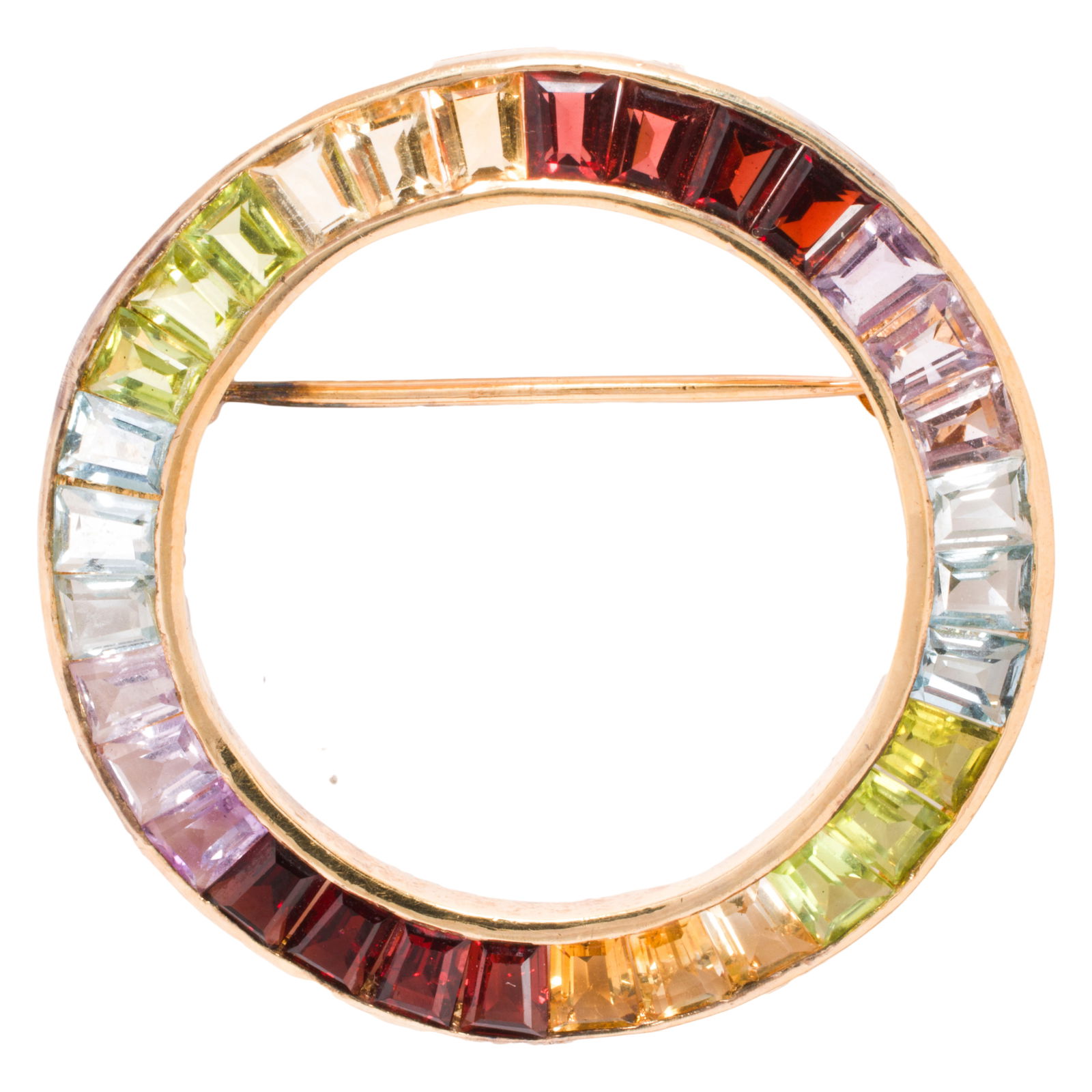 A gold-tone, gem-set brooch: A gold-tone, gem-set broochDesigned as a ring of tapered baguette-cut gemstones including garnet, peridot, and amethyst; width: 1 3/8 in; 6.30 grams