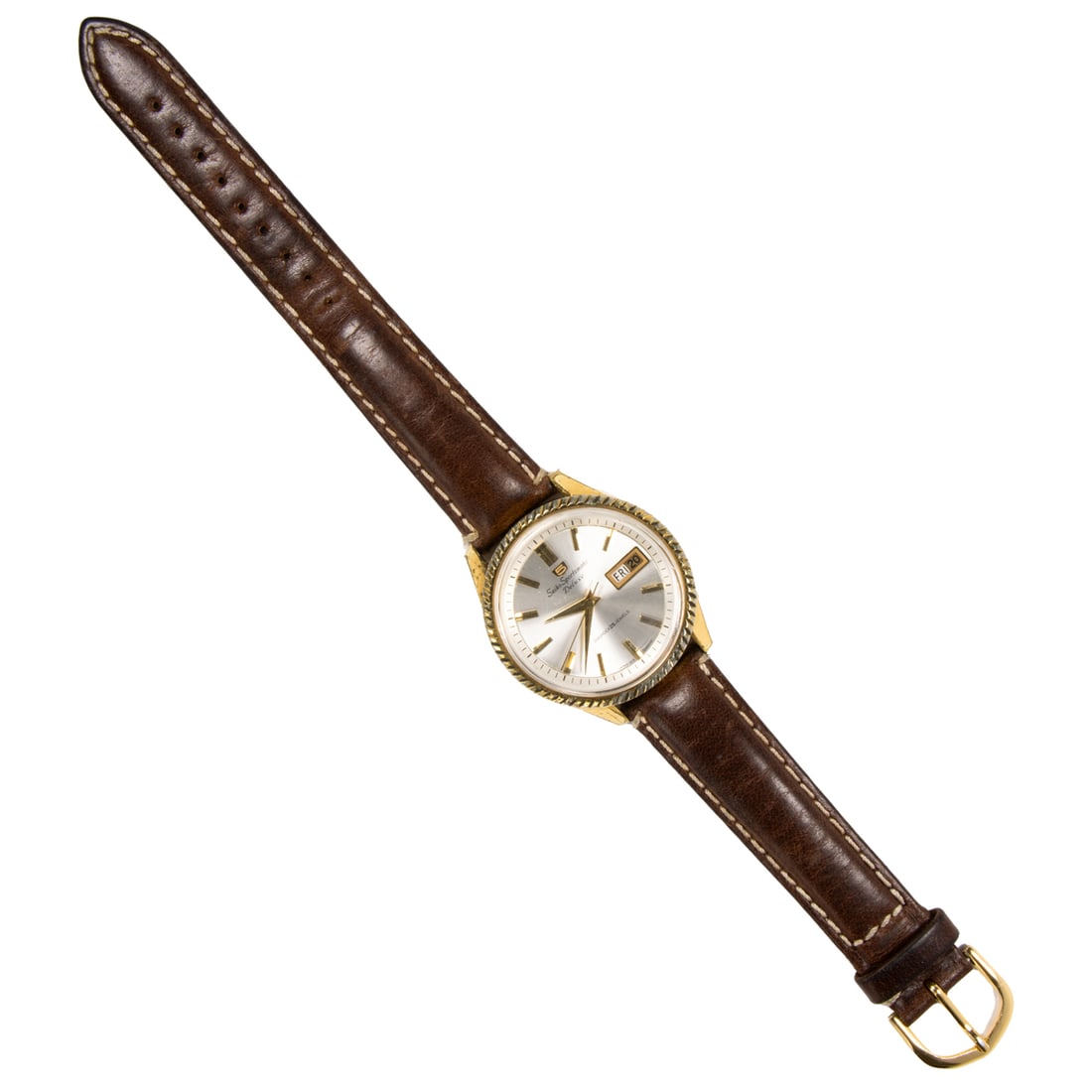 A Seiko Sportsmatic Deluxe stainless steel Watch: A Seiko Sportsmatic Deluxe stainless steel WatchCase no.: 6401612The champagne-toned face, gold stick indices, gold dauphine hands, date indicator, containing a diashock 25 jewels movement, within