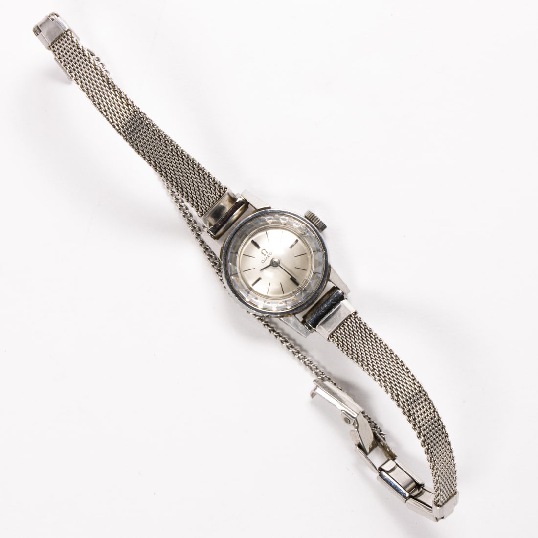 An omega stainless steel cocktail watch: An omega stainless steel cocktail watchCase no.: 511.166Movement no.: 25402609The silver tone face, silver stick indices, silver stick hands, within polished stainless steel case, containing a 17