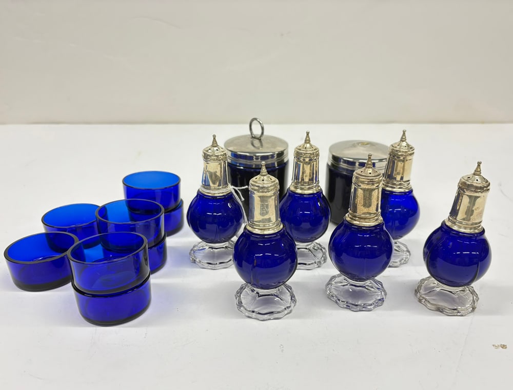 A Group of Cobalt Glass and Porcelain: A group of American cobalt glass and porcelain, comprising (6) cobalt glass salt and pepper shakers with sterling covers, 4.25"h; (8) cobalt glass liners or open salts, 1"h x 2"dia., (2) covered jam