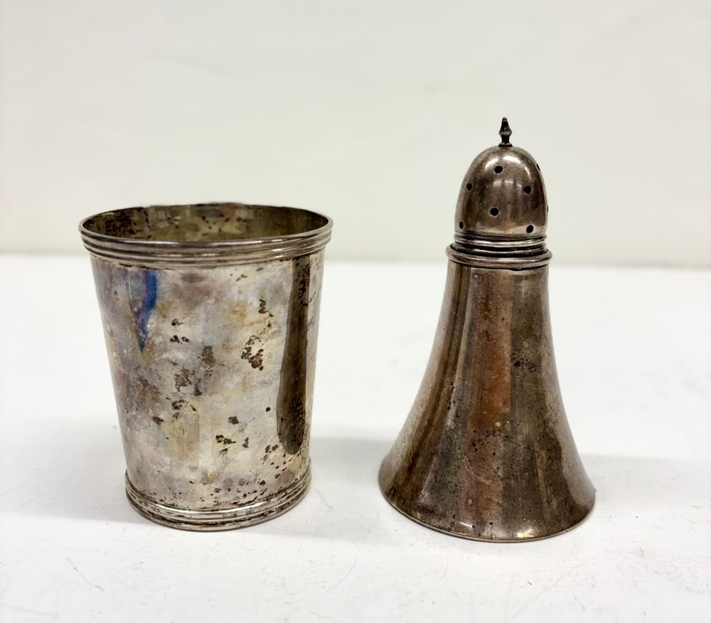 Two pieces of Mexican Silver: Two pieces of Mexican silver, comprising (1) tumbler monogrammed 'CRG' and dated 1964, 3.625"h; and (1) Ortega saltshaker, 5"h. 4.04 troy oz. [2 total]