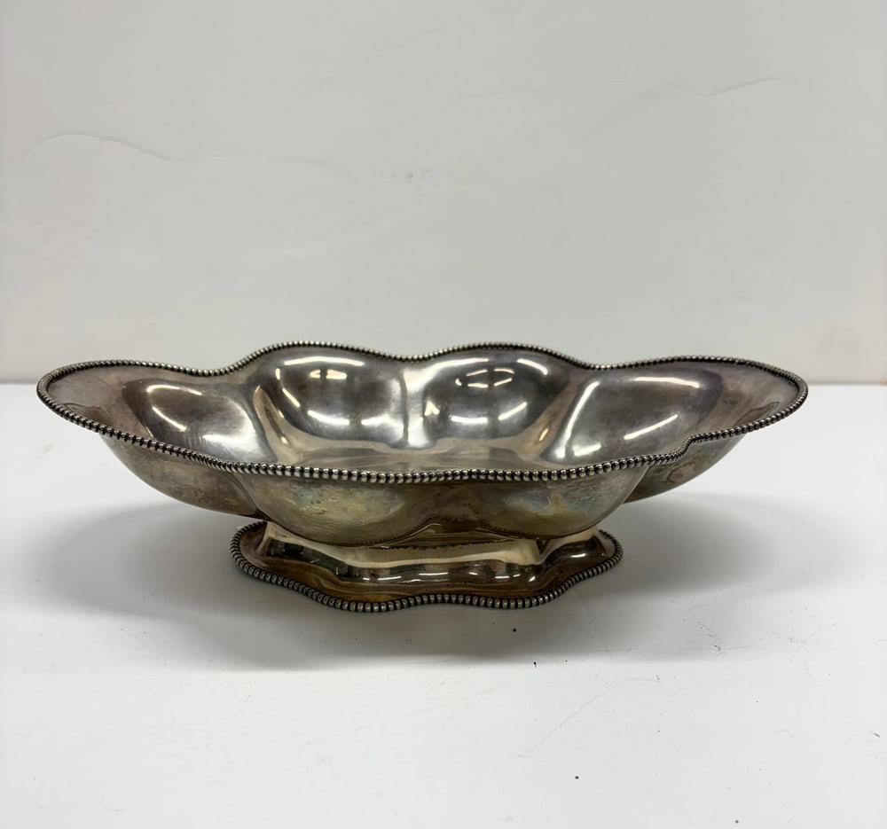 An American William A. Durgin Co Sterling Bowl: An American William A. Durgin Co sterling bowl, retailed by WW Wattles and Sons, with serpentine beaded rim, monogrammed, 11.5"l, 12.05 troy oz