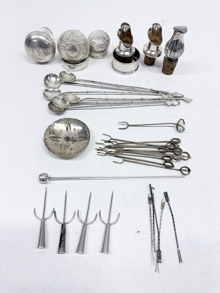 A Group of Sterling and Silverplate Cocktail Articles: A group of sterling and silverplate cocktail articles, comprising (3) glass and sterling stoppers, 1.25" to 3"h, two being monogrammed; (3) napkin rings, one engraved 'Florian'; (3) silverplate wine