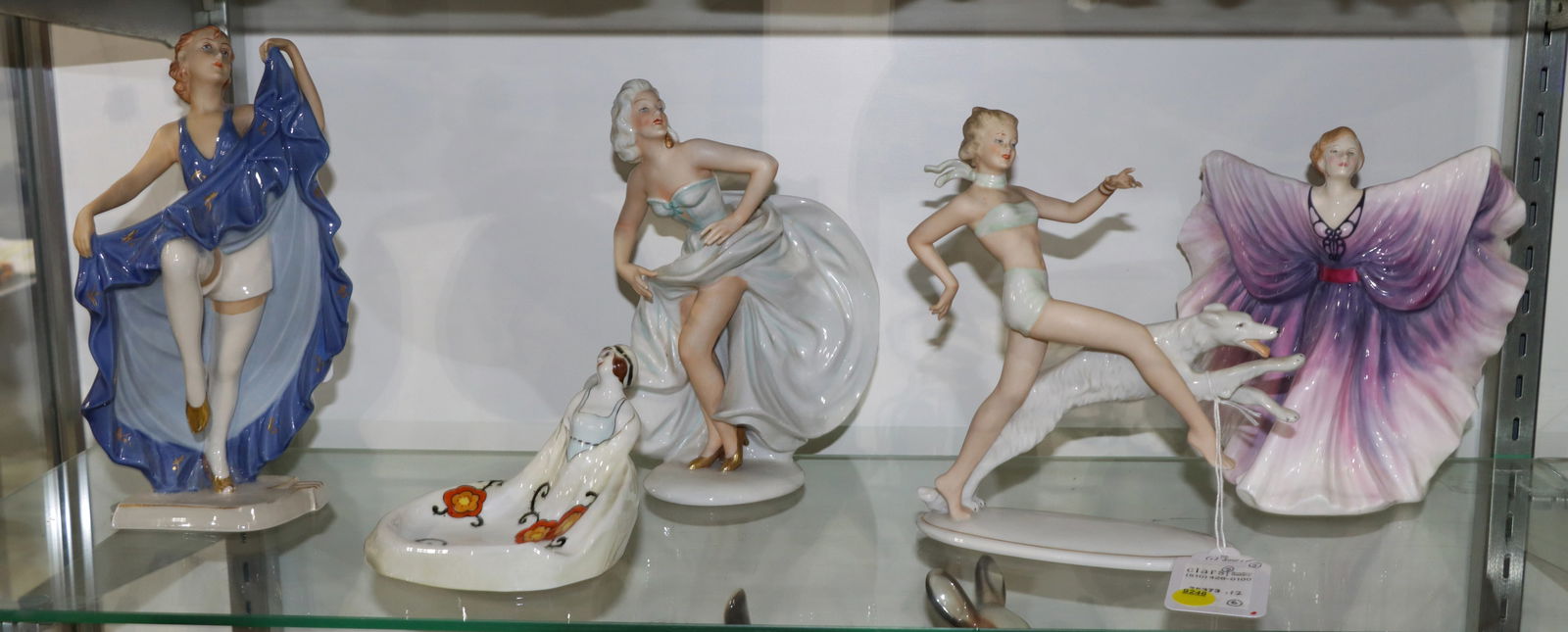 A group of Art Deco and Art Deco Style Ceramic Figures of Women: A group of Art Deco and Art Deco style ceramic figures of women, comprising (1) Royal Doulton figure of Isadora, HN 2938, 8?h; (2) Unterweissbach dancers, 1358 and 9208, 8.5?h and 9?h; (1) Royal Dux