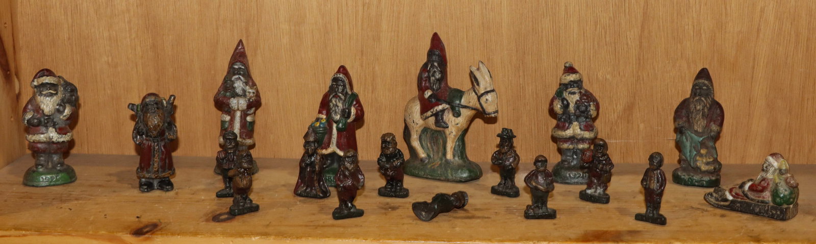 A group of eighteen American painted lead figures of Santa Claus: A group of eighteen American painted lead figures of Santa Claus, 2.25"h to 5.75"h