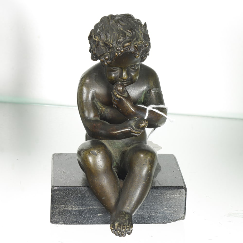 A Continental Bronze Figure of an Infant Satyr on Black Granite Base: A Continental patinated bronze figure of an infant satyr on black granite base, unmarked, 5.75"h