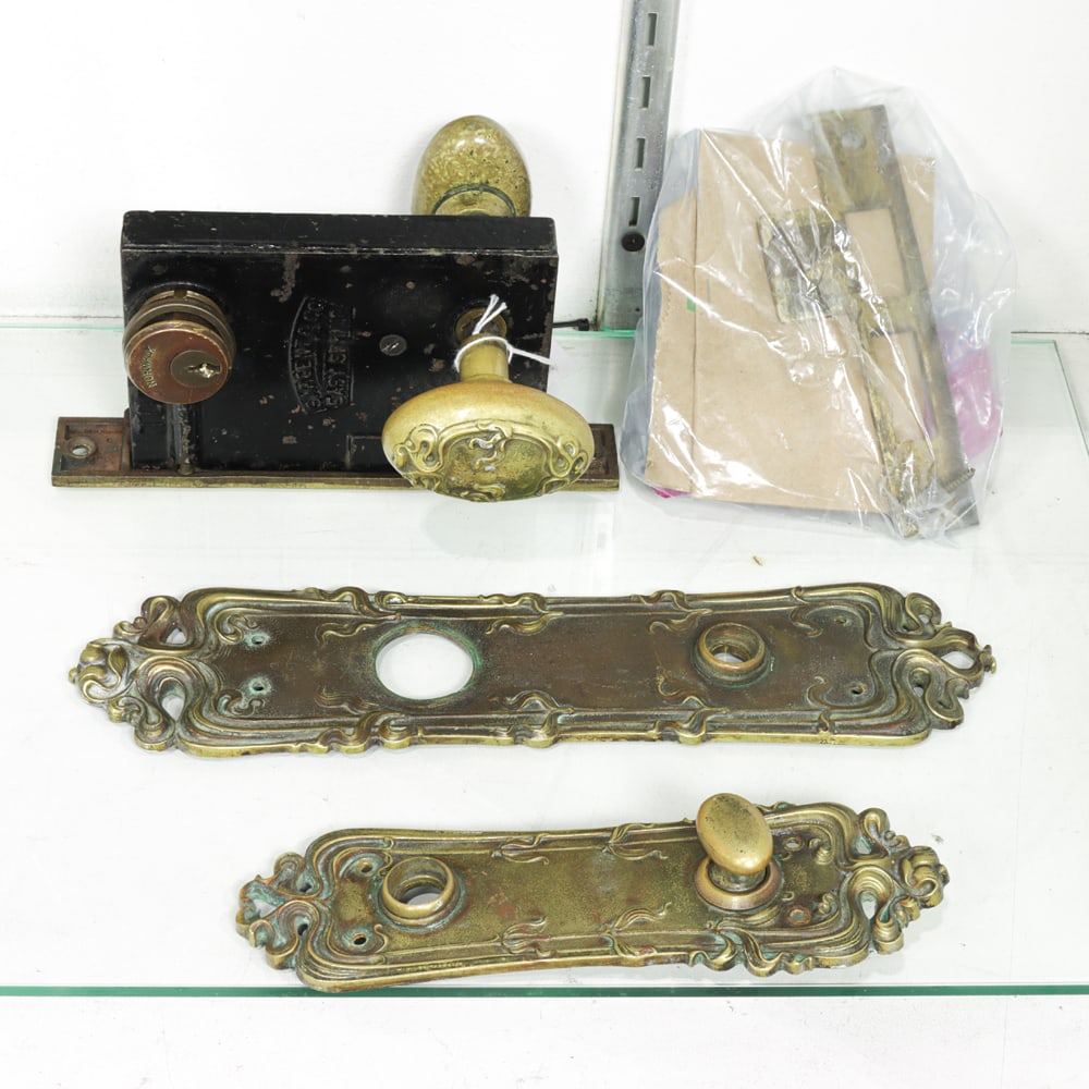 Four Art Nouveau Bronze Door Set Parts: Four Art Nouveau bronze door set parts, comprising one complete door set, with two backplates and other [4 total]