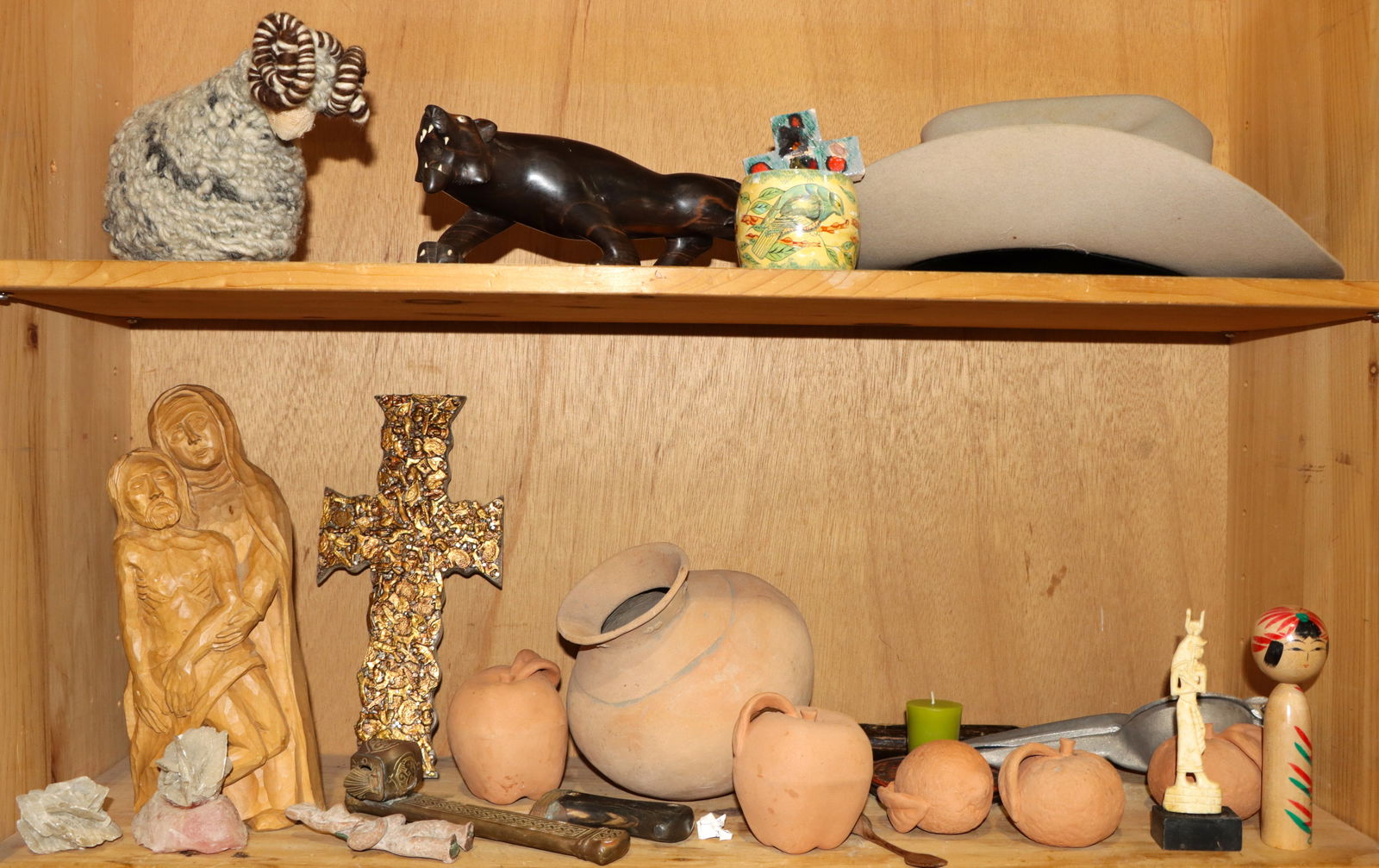 A group of assembled ceramic, wood, metal decorative items: A group of assembled ceramic, wood and metal decorative items, comprising figures, a Chinese ink pot, models of fruit, with a cowboy hat [26 total]