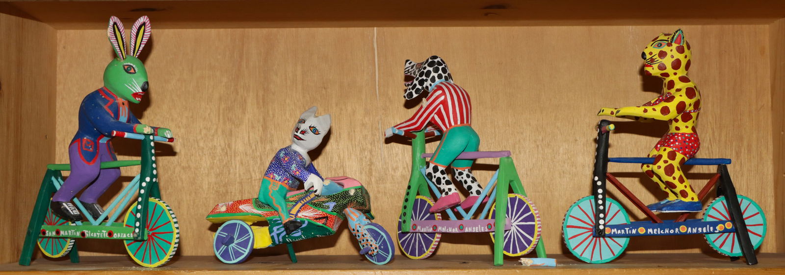 Four Oaxacan painted wood animals: Four Oaxacan painted wood animals, signed 'Martin Melchor Angels', 'Agusta Vaquez Aguilar' and 'San Martin Tileajete Oaxaco, greatest 9"h [4 total]