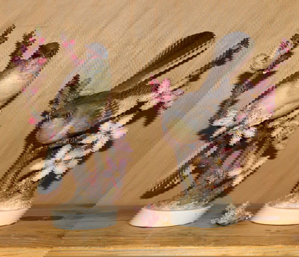 A pair of Royal Worcester bone china mockingbirds: A pair of Royal Worcester bone china mockingbirds, both signed to base, 9.25"h and 10.25"