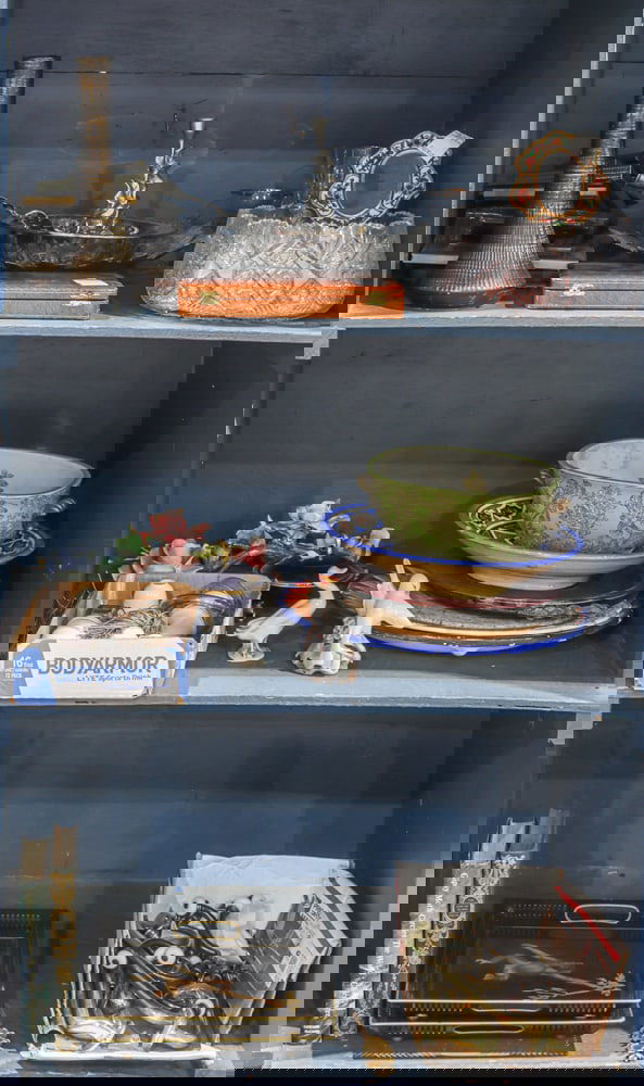 An assembled group of table articles: An assembled group, including Art Deco style knife set in case; Royal Copenhagen group of two birds; pair of tole trays; pair of metal candlesticks, leaf form bowl, McCoy vase, 12.5"w; cut glass