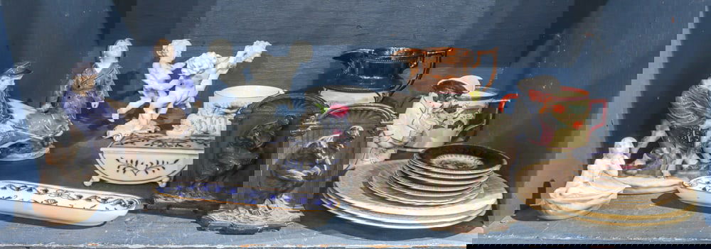 An assembled group of table articles: An assembled group, including (3) Royal Copenhagen porcelain figural groups; (2) Meissen porcelain dresser articles in the Blue Onion pattern; (1) Hutschenreuther porcelain group of three dancing