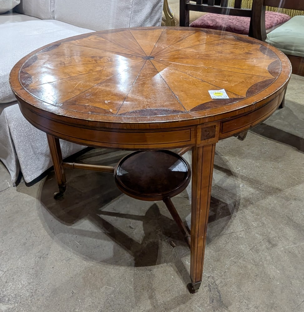 A Regency style marquetry inlaid low table on casters: A Regency style marquetry inlaid low table on casters, 21.5"h x 27.5"dia