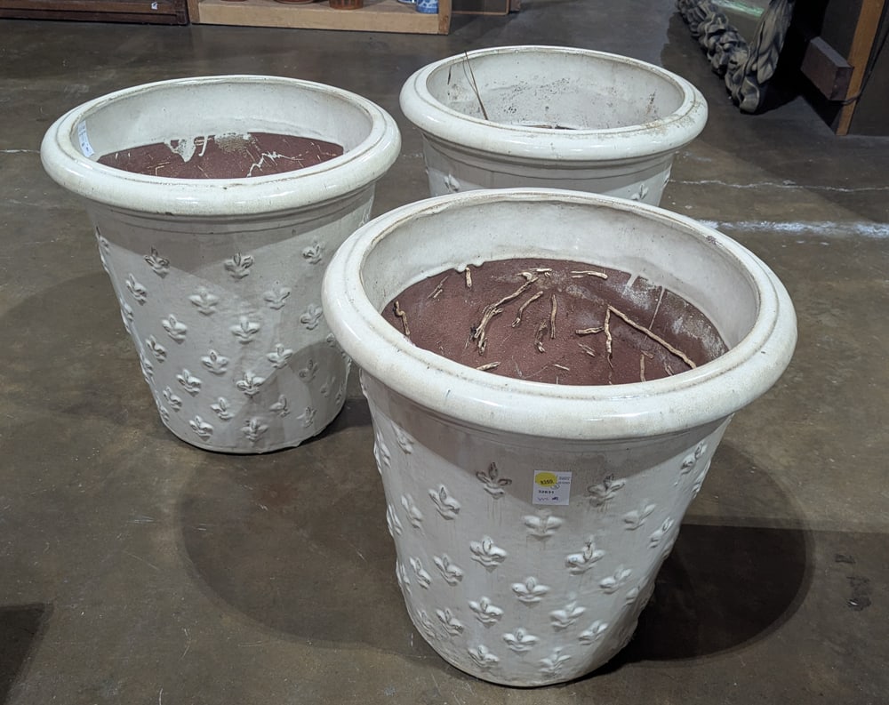 A group of three glazed terra-cotta planters: A group of three glazed terra-cotta planters, each with fleur de lys reserves, 17.5"h x 18"w [3 total]