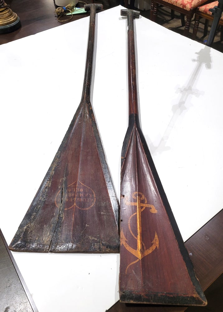 A pair of antique hand hewn boat oars: A pair of hand hewn antique oars, each with polychrome anchor detail on paddle, 56"h x 11.5"w