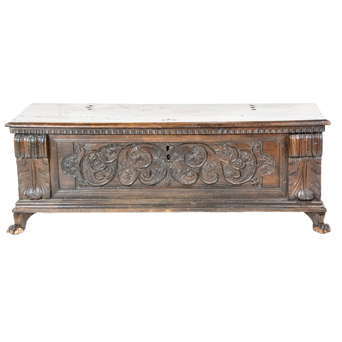 An Italian cassone, circa 1710: An Italian cassone, circa 1710, the central frieze with carved floral and vine sprays centering the carved acanthus pilasters, and rising on paw feet, 25"h x 68"w x 23"d