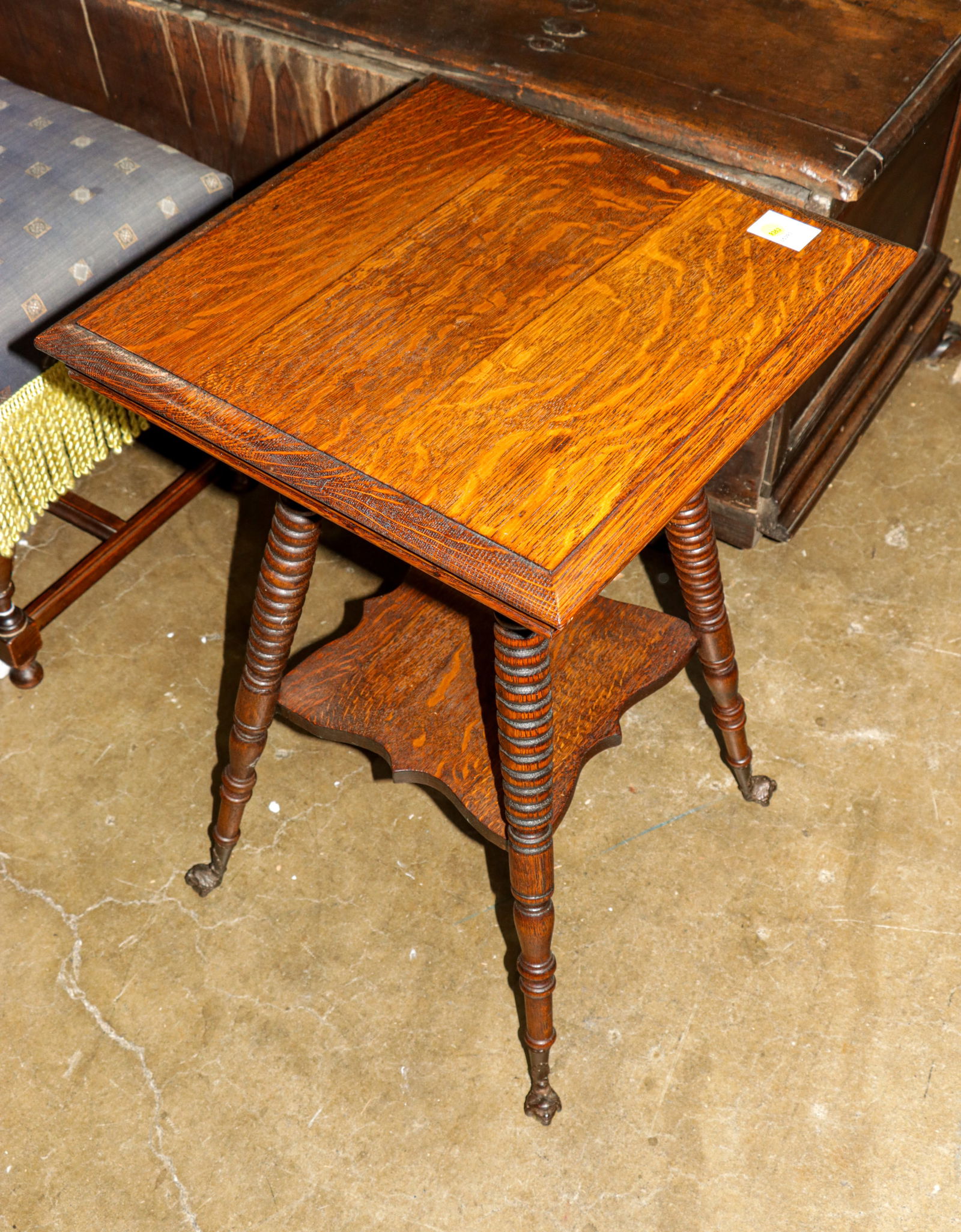 A late Victorian quartersawn oak parlor table: A late Victorian quartersawn oak parlor table, with spherical glass ball feet, 29"h x 18"w x 18"d