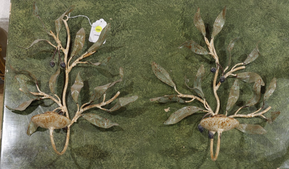 A pair of Italian style painted metal wall lights: A pair of Italian style painted metal wall lights, each in the form of a berried laurel branch incorporating a single candle cup, 16"h