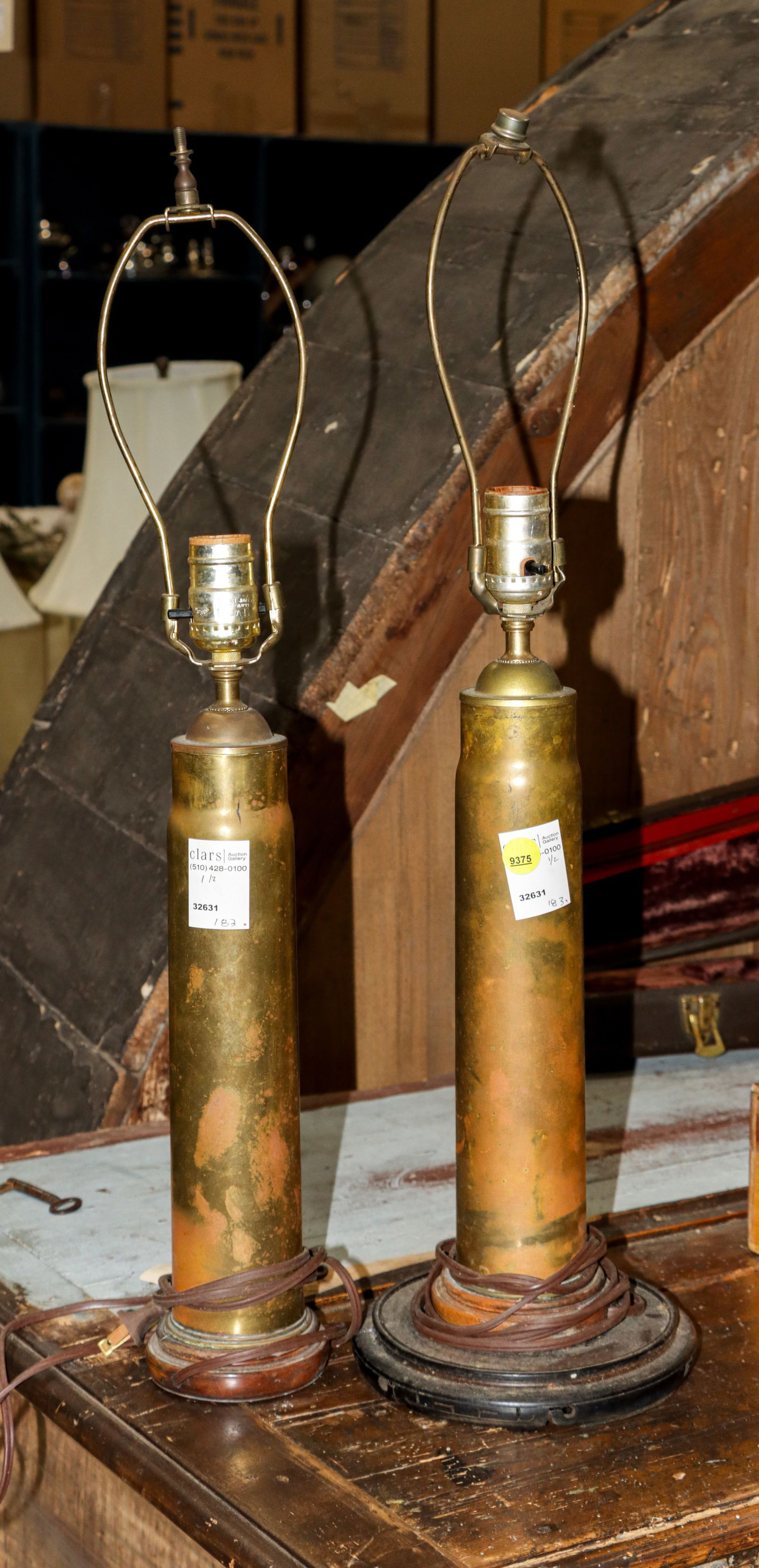 A pair of brass artillery shell casing lamps: A pair of brass artillery shell casing lamps, greatest 25"h x 7"dia