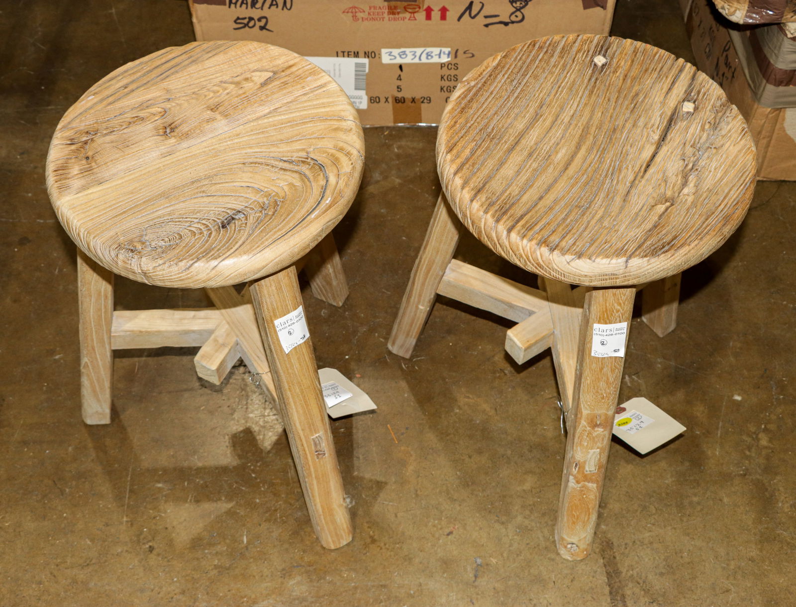 A pair of rustic elmwood stools: A pair of rustic elmwood stools, likely retailed by Saffron & Poe, 20"h x 15.5"w x 12"dia (seat)