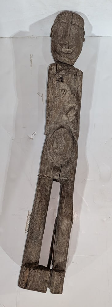 A Dayak carved figure: A Dayak carved figure, 48"h, together with an attenuated figure, 62.5"h [2 total]