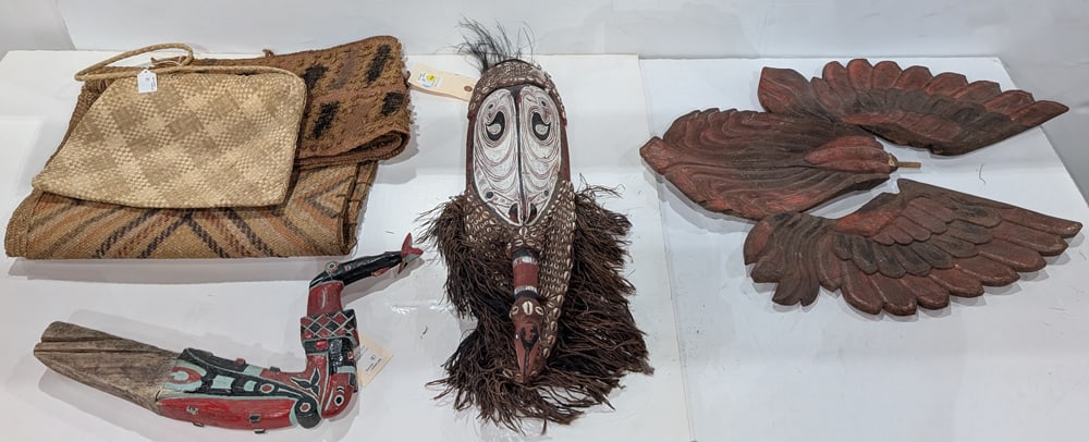 A group of mainly tribal items: A group of mainly tribal items, including (1) Oceanic mask; (1) woven bag; (2) polychrome decorated woven textiles; (3) flame-form wings and (1) polychrome architectural element with fish, greatest