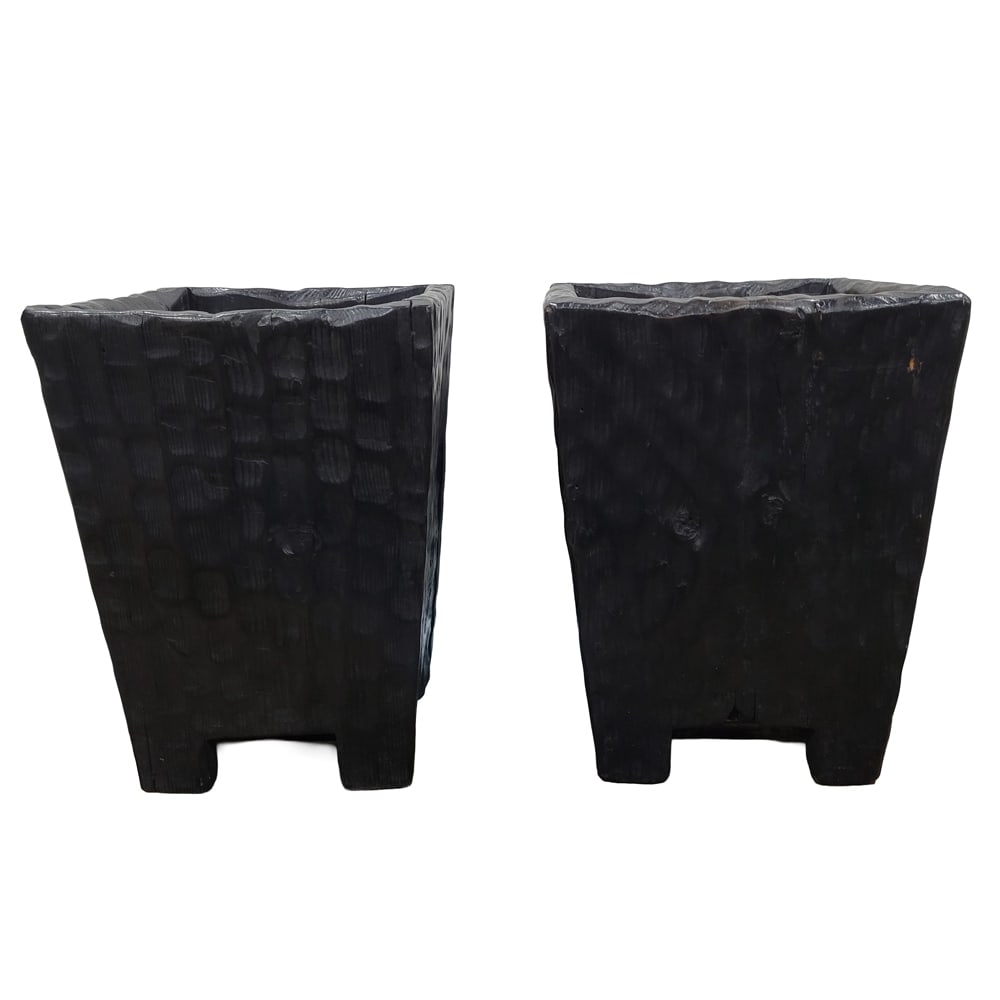 A pair of ebonized rough-hewn wood containers: A pair of ebonized rough-hewn wood containers, each of square tapered outline, 16"h x 11"w x 11"d