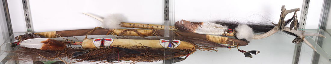 A group of Native American style ceremonial items: A group of Native American style ceremonial items, comprising (1) bow, 46"l; (1) beaded case, 22"l; (2) arrows and (1) staff terminating in antler, 49"l