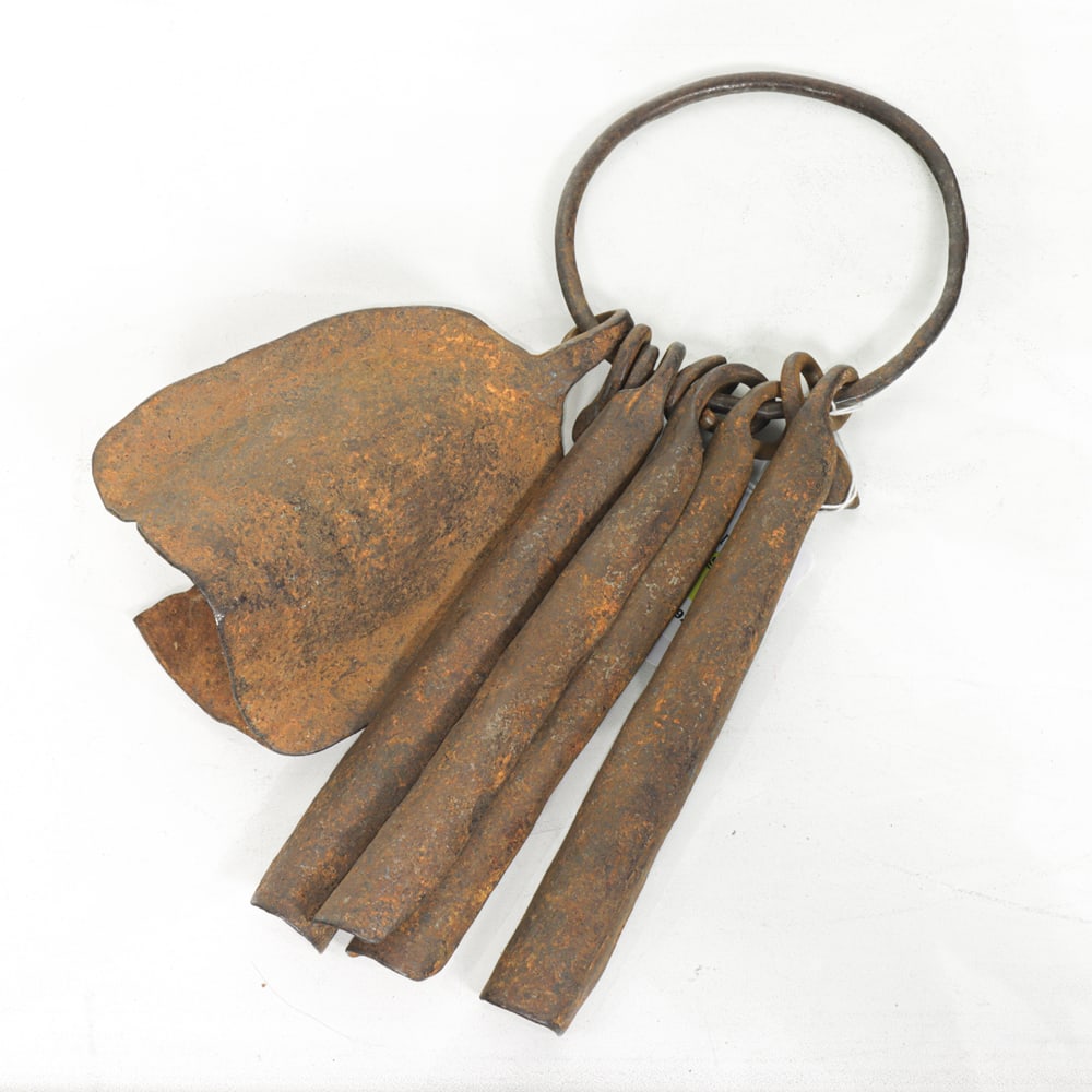 A Group of Pre-Coinage Iron Currency: A group of pre-coinage iron currency on ring, 13.25"l (including ring)