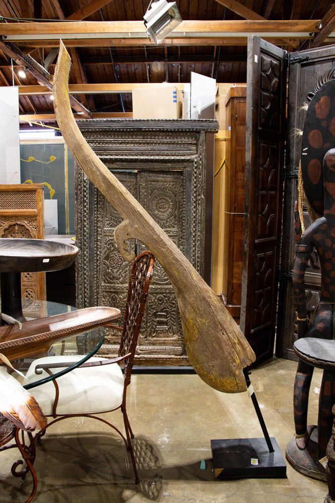 A Thai architectural roof finial: A Thai architectural roof finial, Chofa, 18th century, retains traces of polychrome, approx 86.5"h x 13"w 9.5"d (overall with stand)