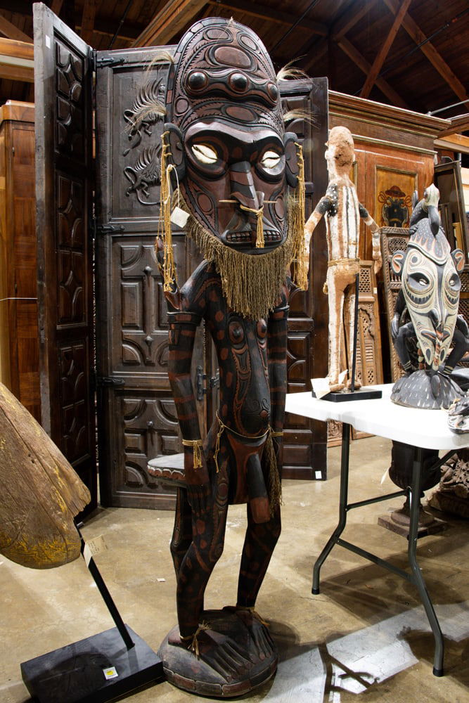 An Oceanic polychrome carved figure with throne seat at reverse: An Oceanic polychrome carved figure with throne seat at reverse, Papua New Guinea, approx 71.5" x 14.5"dia