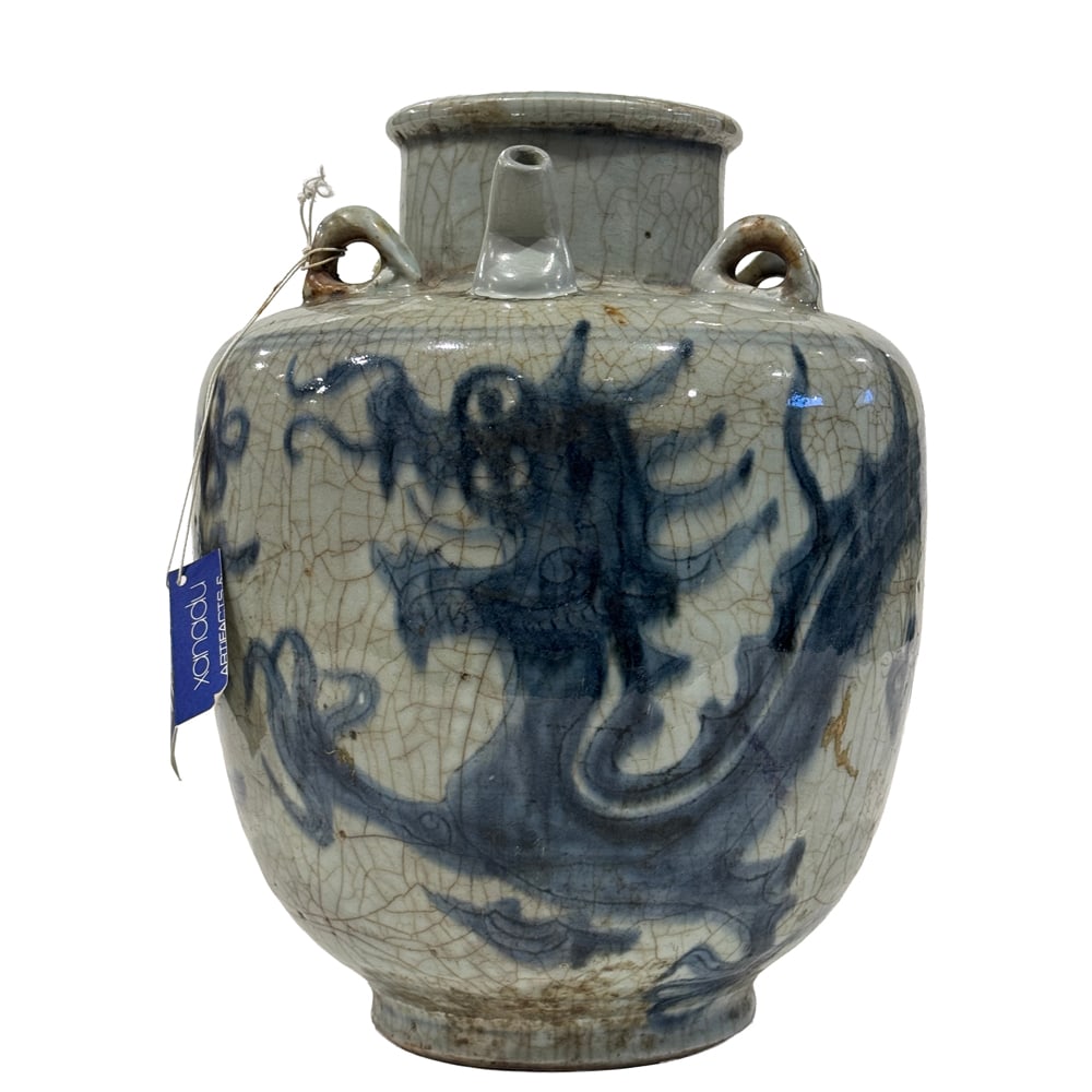 A Chinese blue and white 'dragon' ewer: A Chinese blue and white 'dragon' ewer. Ming dynasty, 12.25" high.