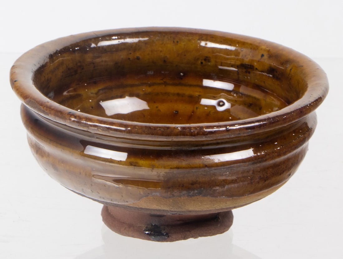 A Chinese amber glazed tea bowl: A Chinese amber glazed tea bowl. Tang or Liao dynasty, 4.25" across.