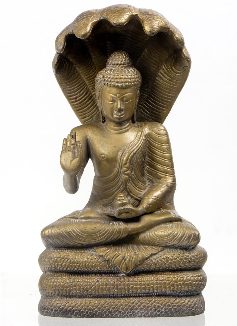 A bronze figure of Mucilinda: A bronze figure of Mucilinda. Seating on tiered base, 11.125" high.